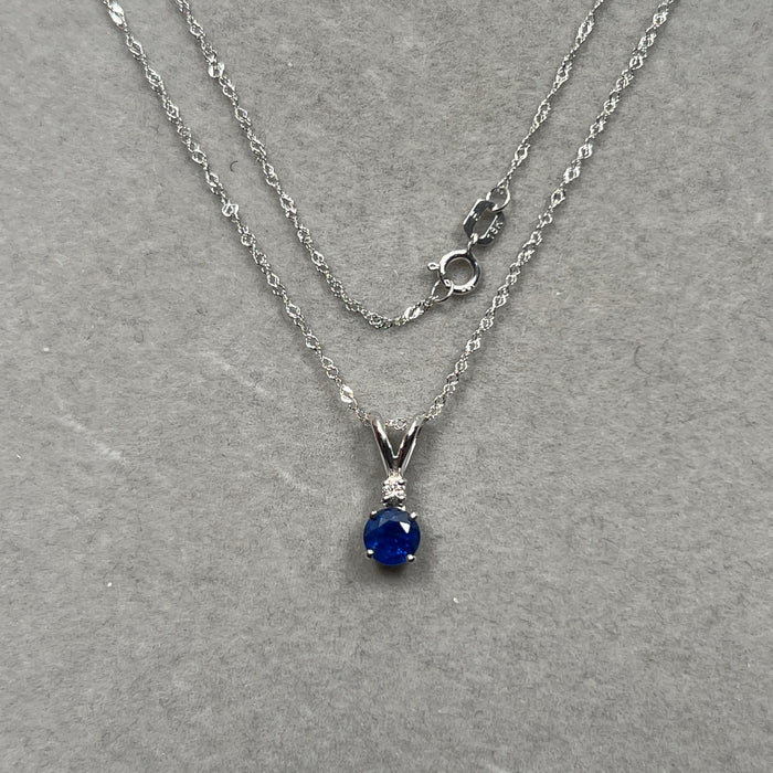 0.03 Cts Diamond & 0.59 Cts Blue Sapphire Pendant in 18K White Gold