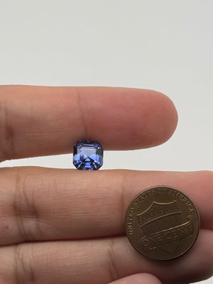 Lab created blue sapphire asscher cut square gemstone step facets close up