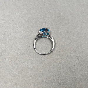 0.02 Ct Diamond & 4.01 Ct 10 mm AAA Trillion Blue Topaz Ring in 14K White Gold