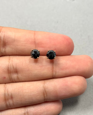 EGL USA certified AAA round rose cut black diamond stud earrings in 14K yellow gold, featuring two diamonds totaling 1.95–2.44 carats, sized 5.70–7.13 mm, secured in a four prong setting with push back closure. 