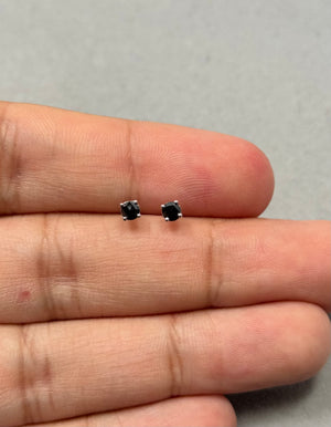 Platinum stud earrings featuring two AA quality round rose cut black diamonds, each measuring 2.5–3.0 mm and totaling approximately 0.23–0.30 carats, secured in four prong settings with push back closures for women. 