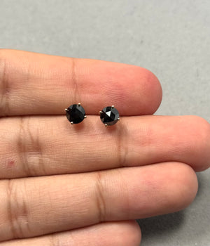 Round rose cut black diamond stud earrings crafted in solid 18K yellow gold, featuring two AAA quality black diamonds measuring 5.40–6.00 mm, four prong set with secure push backs, minimalist fine jewelry designed for women. 