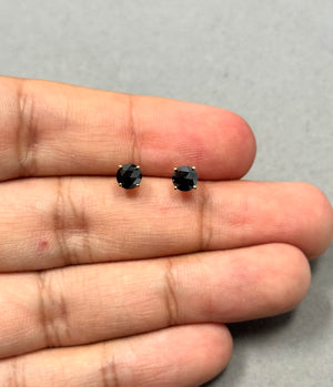 18K yellow gold stud earrings featuring round rose cut black diamonds in a classic four prong setting. Each earring displays an AAA quality black diamond with a combined weight of about 1.00 carat and a refined 5.40–5.50 mm size. 