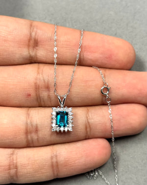 0.36 Ct Diamond & 1.03 Ct London Blue Topaz Cluster Pendant in 14K White Gold, Emerald Cut Topaz with Diamond Accents, 18” Chain