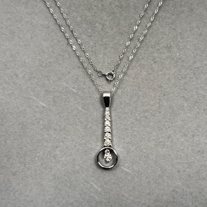 Seven-stone diamond pendant shown on 18 inch chain