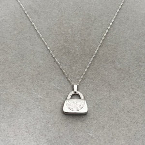 14K white gold purse pendant with 0.25–0.30 ct natural diamonds