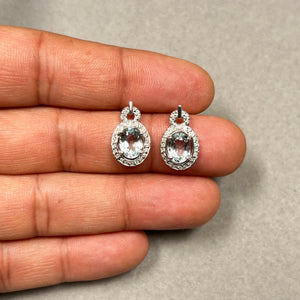 Oval aquamarine halo earrings in 14K white gold