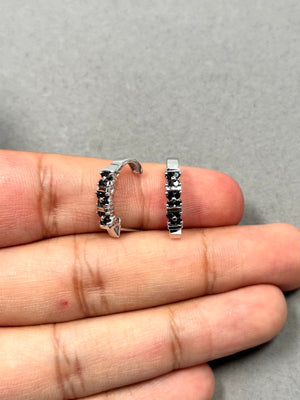 Elegant 0.52 Ct Black Diamond Huggie Earrings in 14K White Gold featuring 24 round black diamonds in prong settings. Polished with rhodium for a sleek finish, these hoops offer timeless sophistication and effortless luxury for everyday or evening wear. 