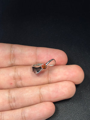 14K white gold wave ring with round diamond showing red color