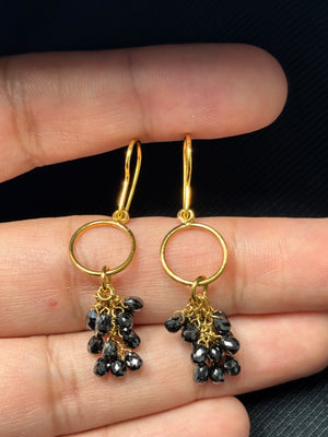 Pair of 18K yellow gold earrings with briolette black diamonds