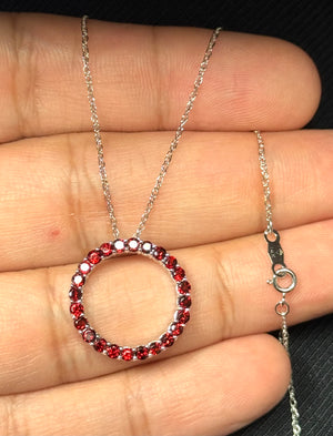 Garnet circle pendant in 14K white gold