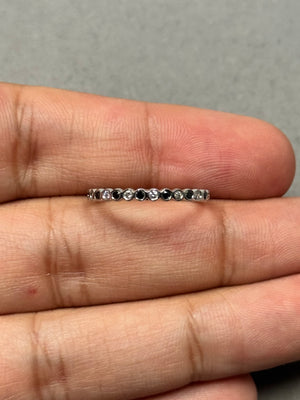 Black and white diamond eternity ring in 18K white gold