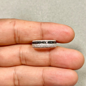 14K white gold low-profile black and white diamond ring on display, 23 round AA black diamonds and 103 white diamonds prong set for women’s fine jewelry