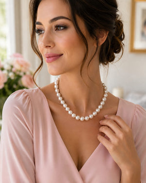 Elegant woman wearing bold pearl necklace for formal evening styling