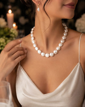 Women wearing a Pearl strand worn at elegant dinner styling wedding necklace inspiration