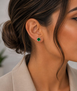 Woman wearing emerald studs with blazer styling for elegant office jewelry inspiration
