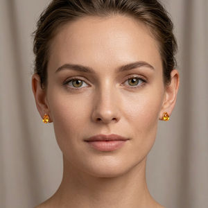 Yellow sapphire studs worn on ear styled for everyday elegant jewelry look